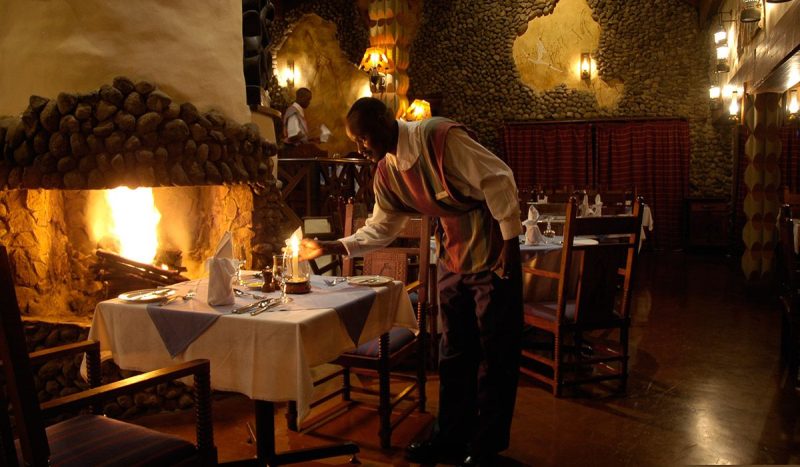 Dinner by the fireplace at Ngorongoro Serena Safari Lodge.