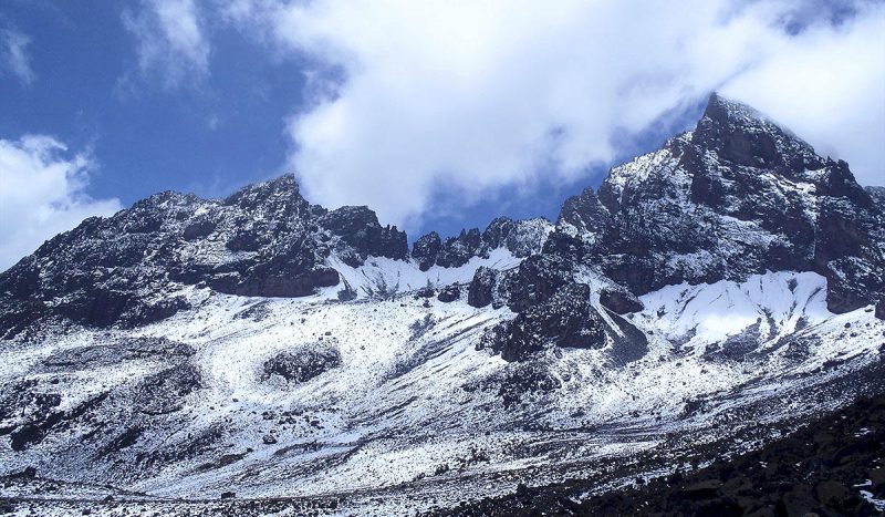 Snow covers the top of Mt. Kilimanjaro.